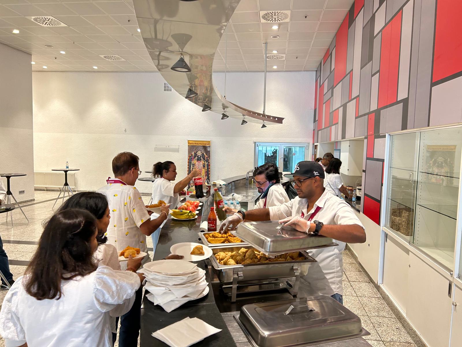 Volunteers serving food at HM Europe event