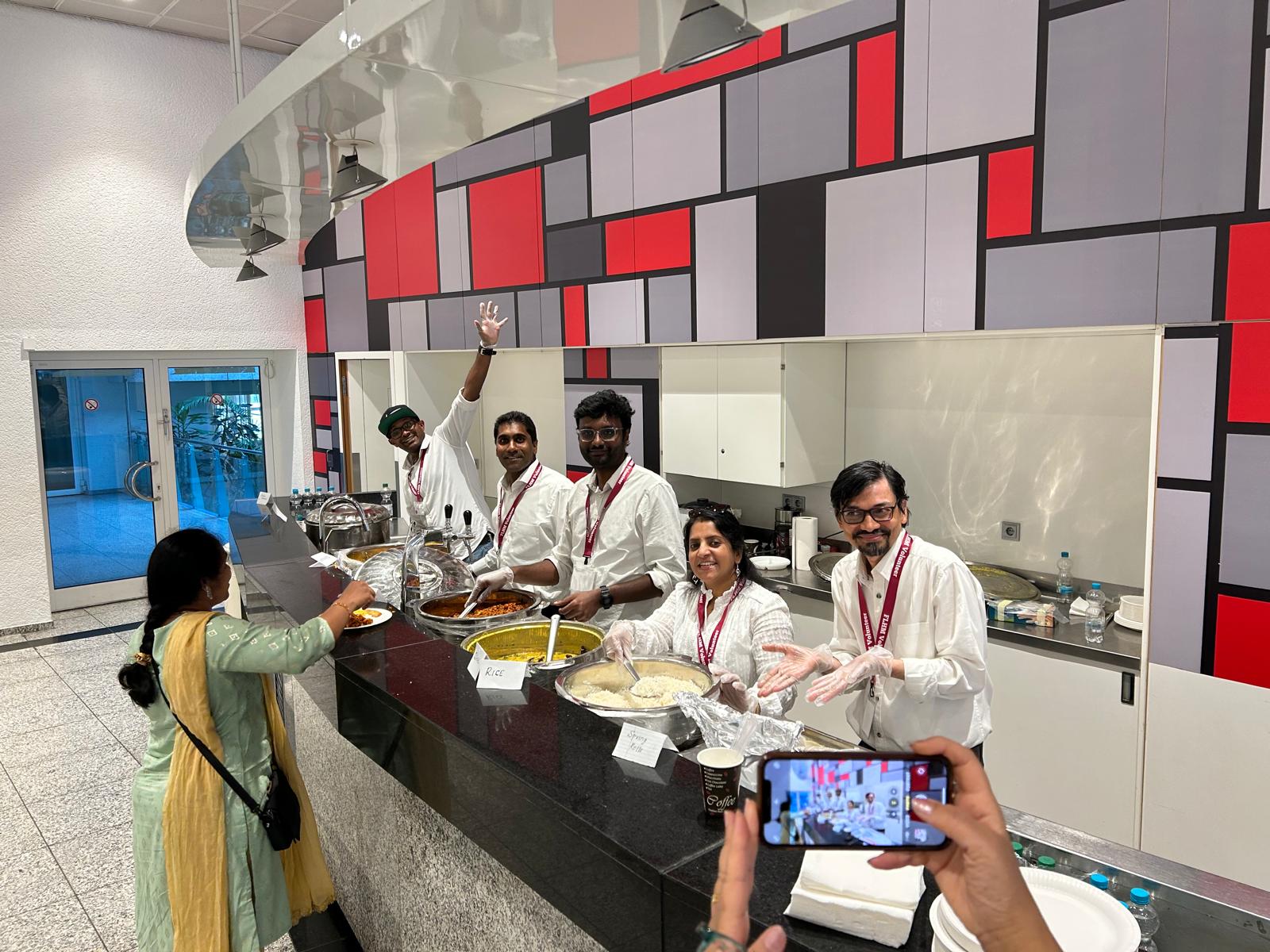 Volunteers serving food at event